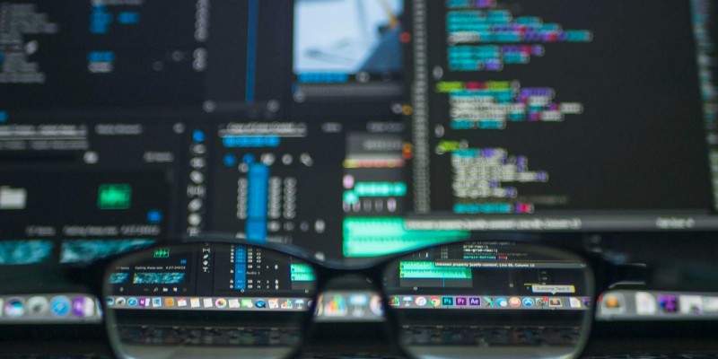 Modern office workspace with laptops and notes